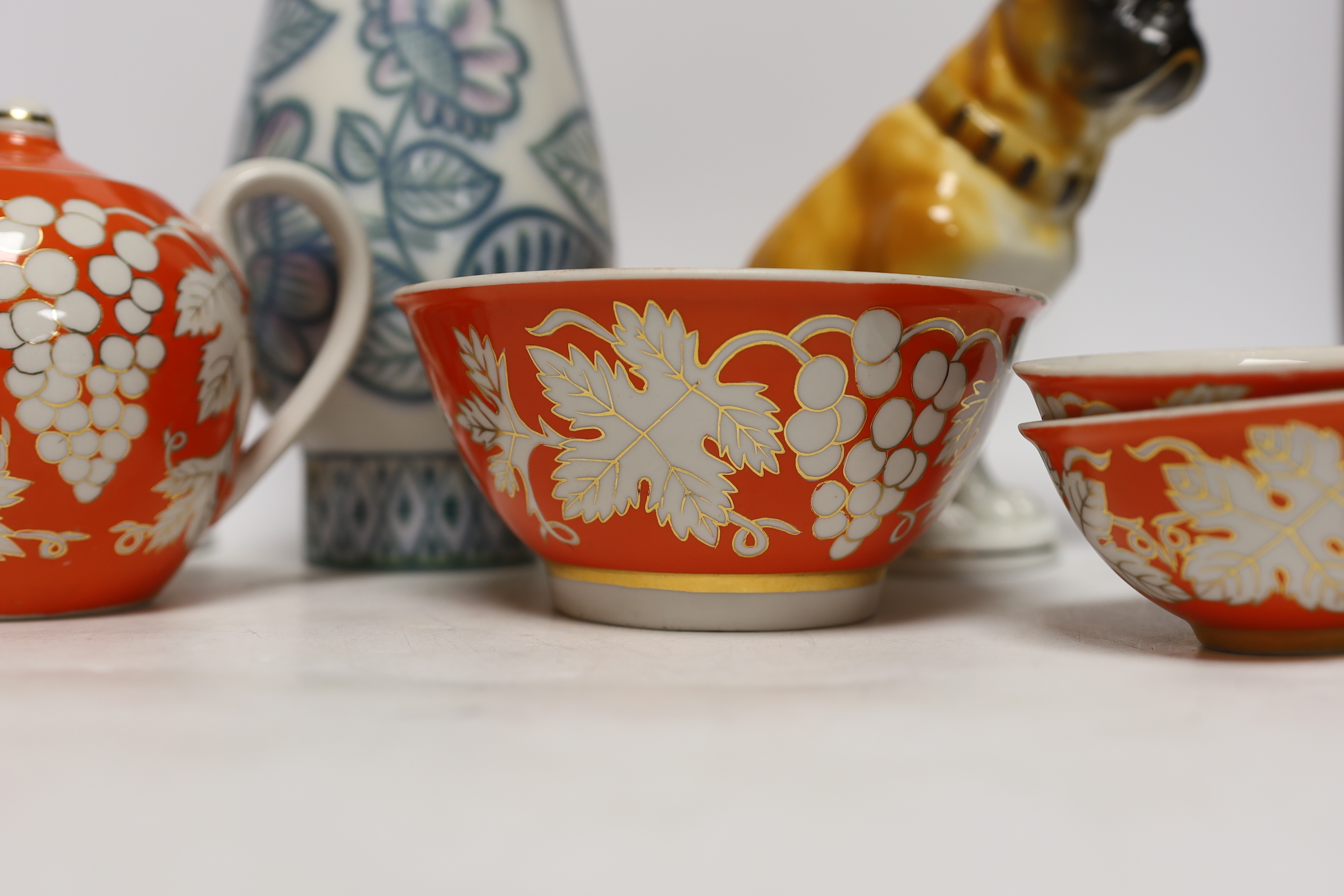 A pair of Russian porcelain models of French bulldogs, a part Chinese (Russian) tea set and a vase